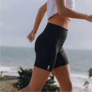 Daily Drills High Waisted Logo Workout Biker Shorts in True Black 7 Inch Inseam